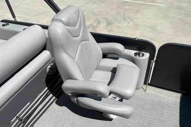 Slide: The Image of Luxurious seating on 2020 Manitou 25 OASIS SL VP pontoon boat, featuring plush gray upholstery. - 16