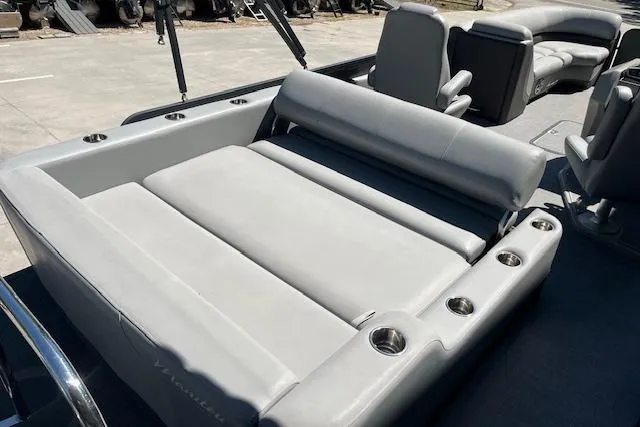 Slide: The Image of 2020 Manitou 25 OASIS SL VP boat interior with gray seating and cup holders. - 17