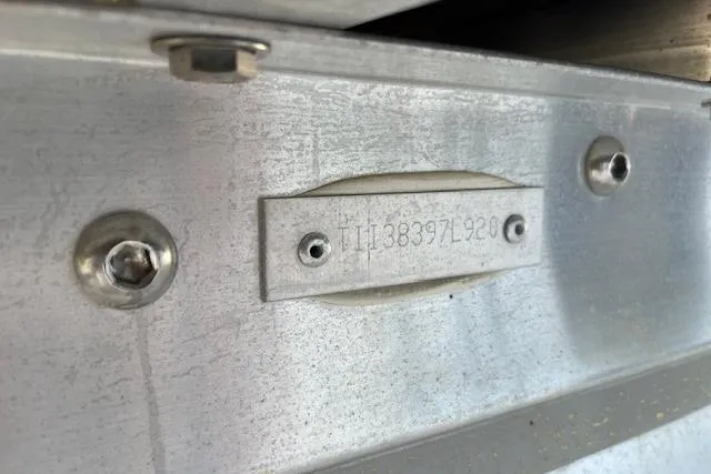 Slide: The Image of Close-up of a 2020 Manitou 25 OASIS SL VP serial number plate on metal surface. - 20
