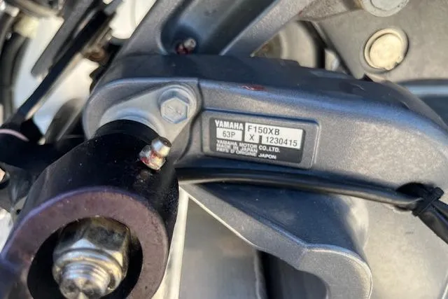 Slide: The Image of Close-up of Yamaha F150XB engine part on 2020 Manitou 25 OASIS SL VP boat. - 21
