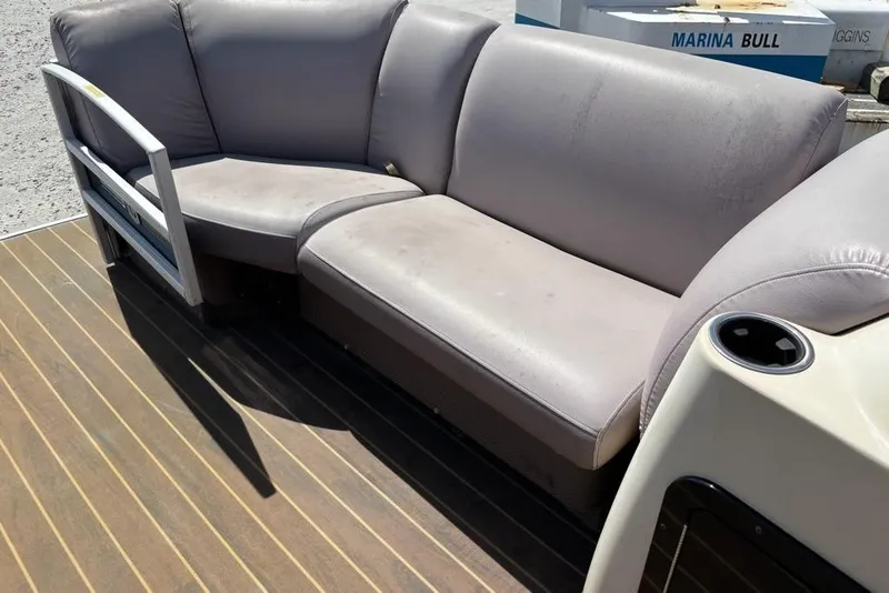 Slide: The Image of 2020 Godfrey Sweetwater 2286 FS boat seating area with gray upholstery and cup holder. - 4