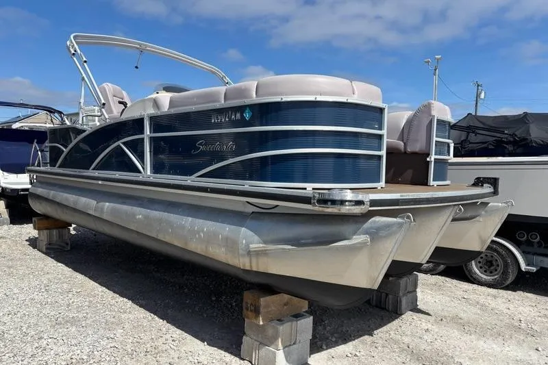 The Image of 2020 Godfrey Sweetwater 2286 FS pontoon boat on display, blue exterior, parked on blocks. - 0