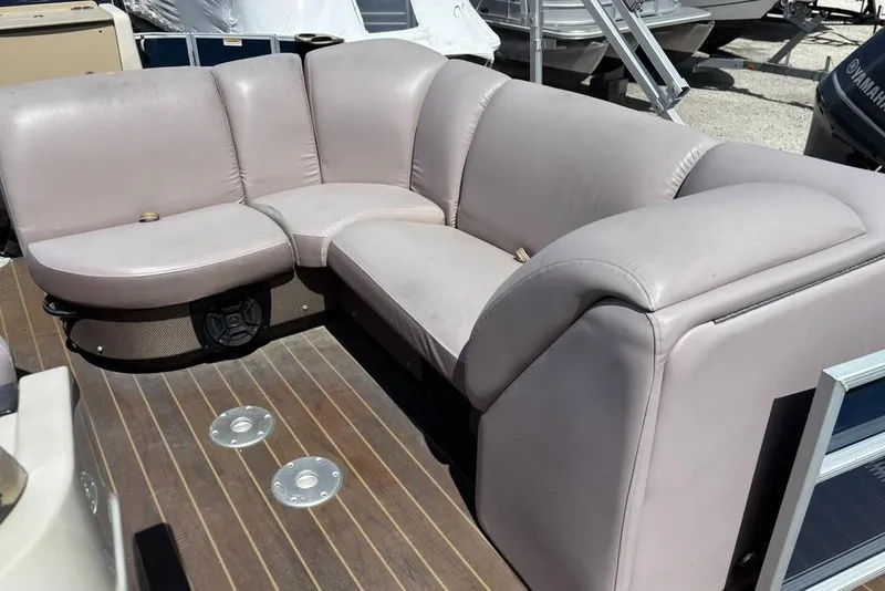 Slide: The Image of 2020 Godfrey Sweetwater 2286 FS boat interior with plush seating and wood-style flooring. - 8