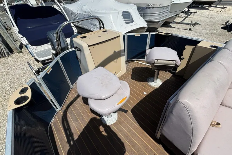 Slide: The Image of 2020 Godfrey Sweetwater 2286 FS boat interior with seating and cup holders. - 9