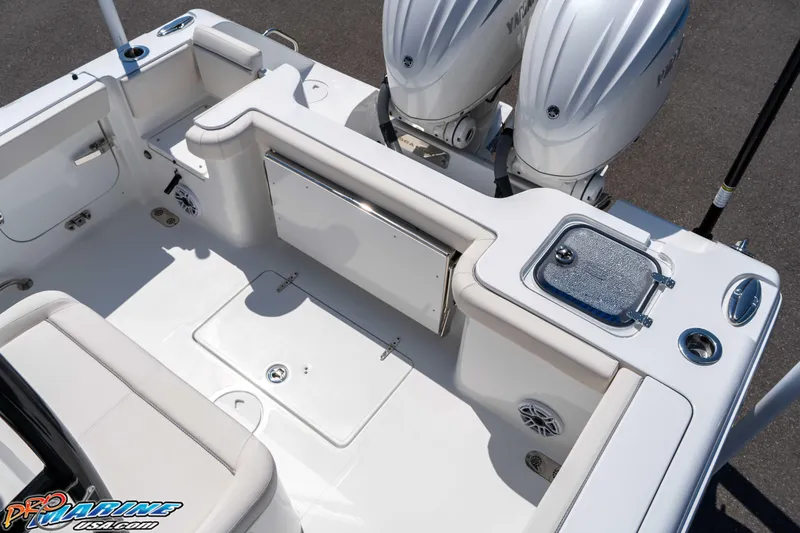 Slide: The Image of 2025 Sea Hunt Gamefish 28 boat interior with dual engines and seating area. - 12