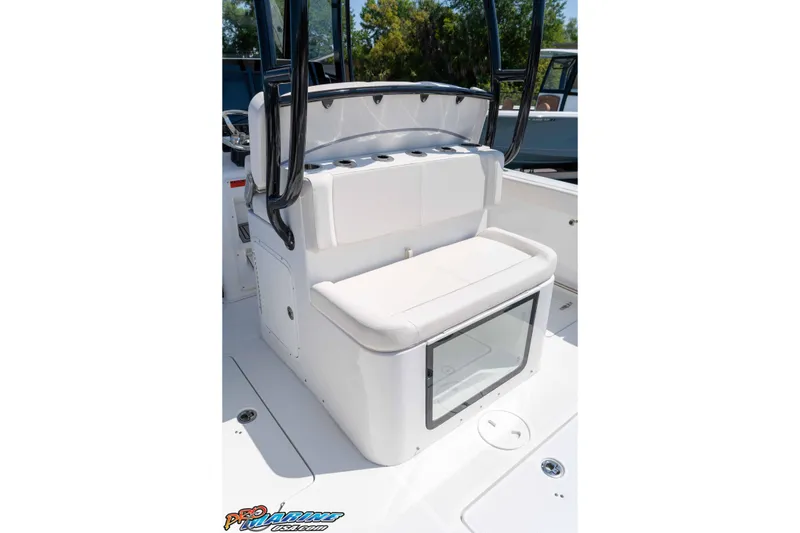 Slide: The Image of 2025 Sea Hunt Gamefish 28 Forward Seating boat interior with cushioned seating and storage. - 14