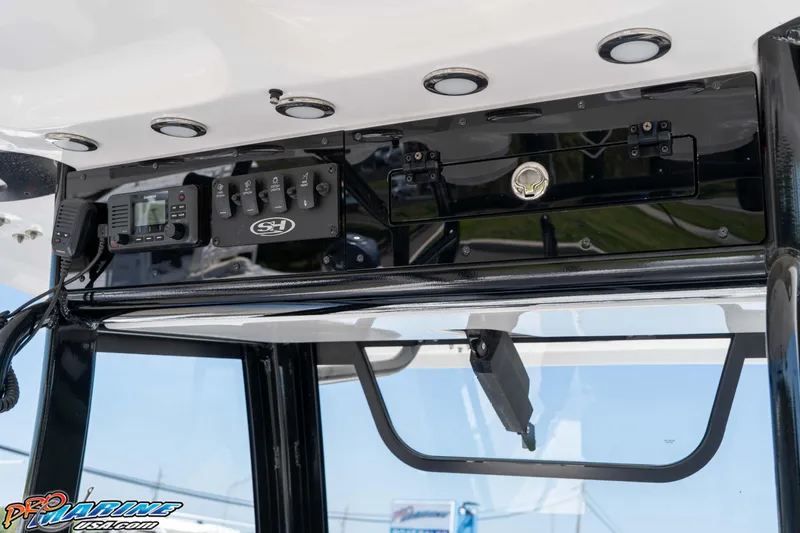 Slide: The Image of 2025 Sea Hunt Gamefish 28 Forward Seating dashboard with controls and electronics. - 21