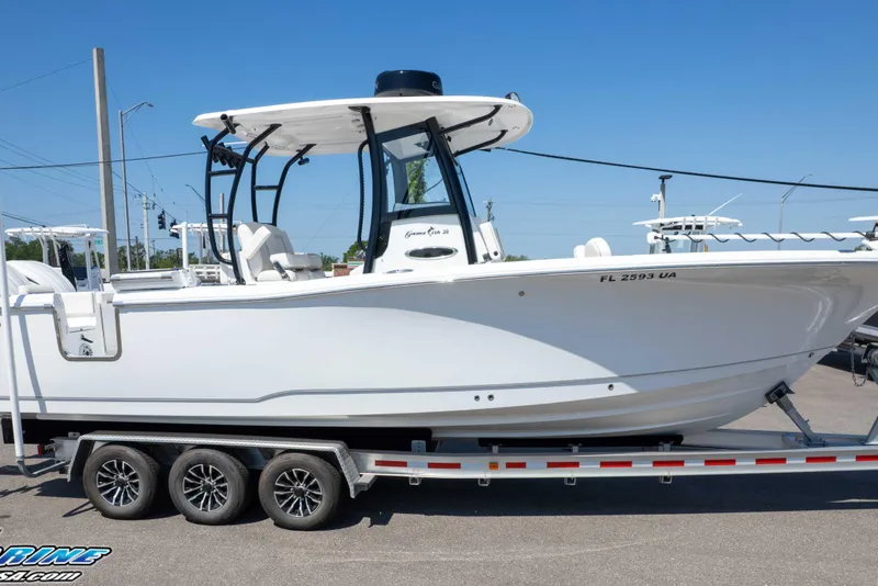 Slide: The Image of 2025 Sea Hunt Gamefish 28 Forward Seating boat on trailer, side view. - 31
