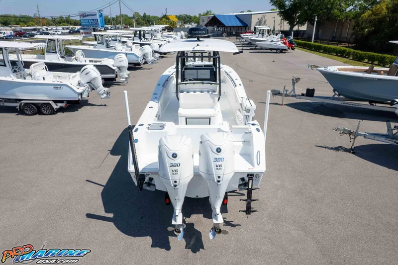 Slide: The Image of 2025 Sea Hunt Gamefish 28 Forward Seating boat displayed at a dealership. - 35