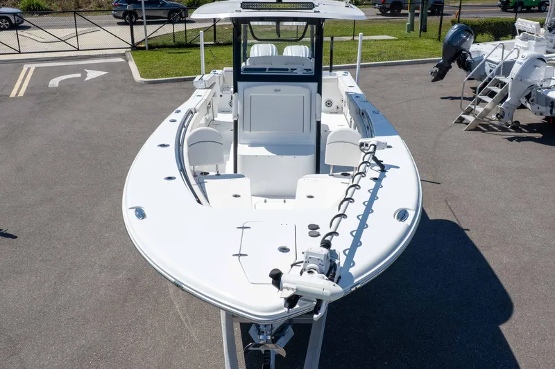 Slide: The Image of 2025 Sea Hunt Gamefish 28 Forward Seating boat, docked, showcasing sleek design and spacious layout. - 43