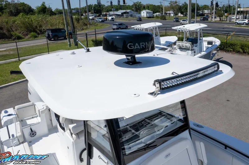 Slide: The Image of 2025 Sea Hunt Gamefish 28 boat with Garmin radar and LED light bar on the roof. - 47