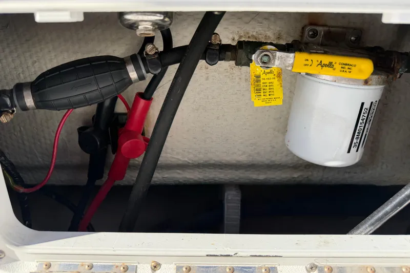 Slide: The Image of Engine compartment of 2020 Tideline 235 Hybrid with fuel filter and hoses visible. - 11