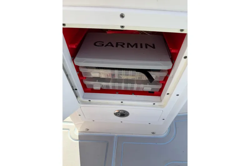 Slide: The Image of Storage compartment on a 2020 Tideline 235 Hybrid boat with Garmin equipment. - 17