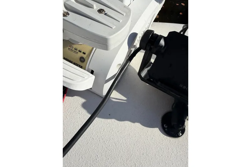 Slide: The Image of Close-up of a Minn Kota motor on a 2020 Tideline 235 Hybrid boat. - 19