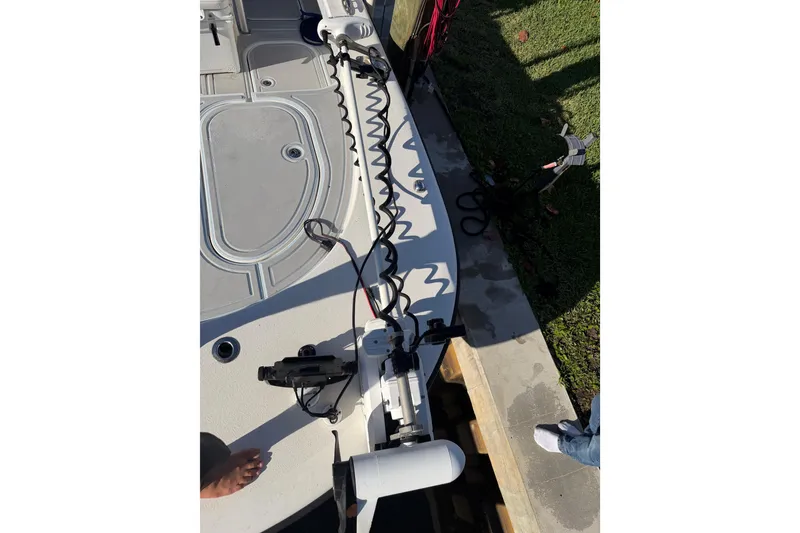Slide: The Image of 2020 Tideline 235 Hybrid boat deck with fishing equipment and coiled cables. - 21