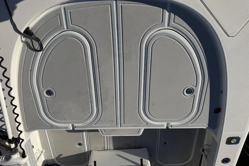 Slide: The Image of 2020 Tideline 235 Hybrid boat deck with storage compartments and sleek design. - 22
