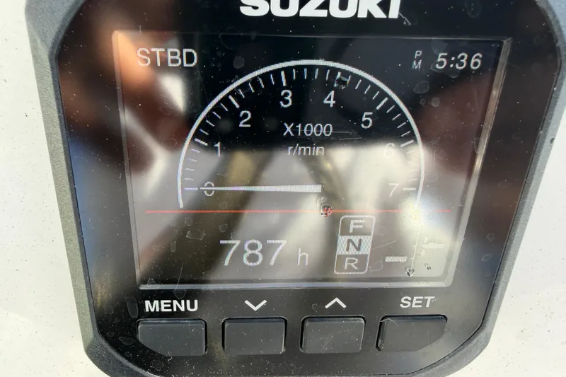 Slide: The Image of Suzuki engine display showing 787 hours on a 2020 Tideline 235 Hybrid boat. - 35