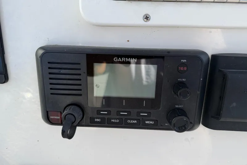 Slide: The Image of Garmin marine radio on 2020 Tideline 235 Hybrid boat dashboard. - 45