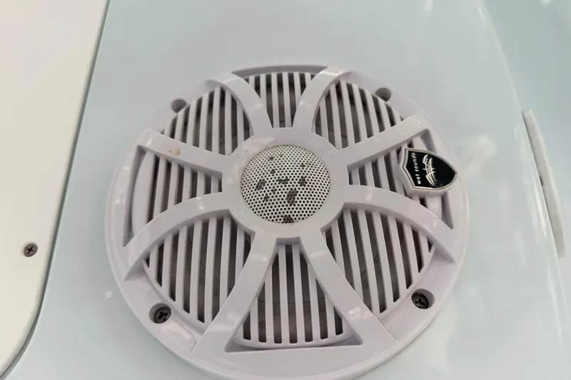 Slide: The Image of Speaker grille on 2020 Tideline 235 Hybrid boat, featuring a marine audio system. - 47