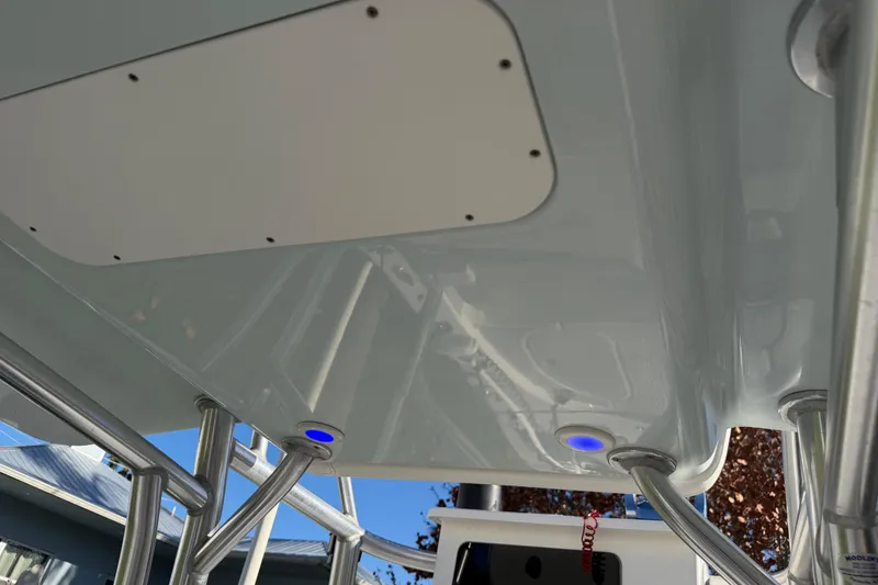 Slide: The Image of 2020 Tideline 235 Hybrid boat interior with blue LED lights and metal framework. - 49