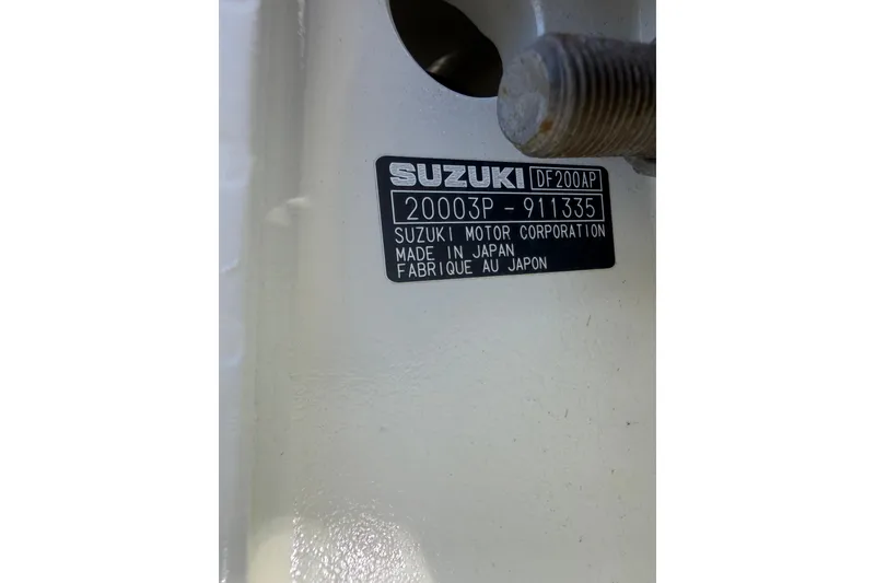 Slide: The Image of ```json { "alt_text": "Suzuki DF200AP engine label on 2020 Tideline 235 Hybrid." } ``` - 5