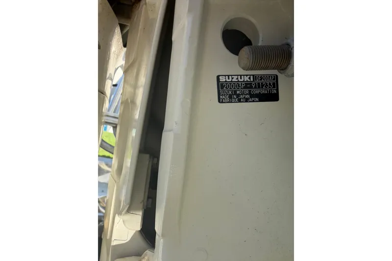 Slide: The Image of Suzuki motor label on 2020 Tideline 235 Hybrid boat, showing model and manufacturing details. - 6