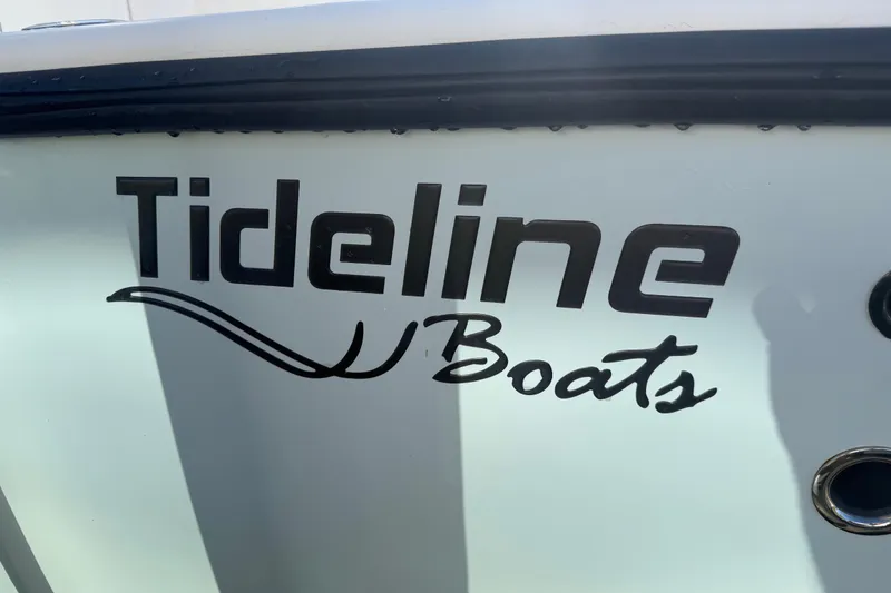 Slide: The Image of Close-up of Tideline Boats logo on 2020 Tideline 235 Hybrid. - 61