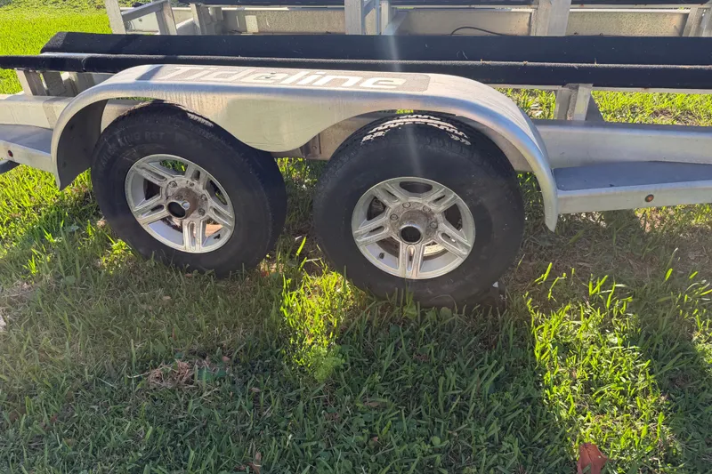 Slide: The Image of Trailer with dual wheels for 2020 Tideline 235 Hybrid on grass. - 69