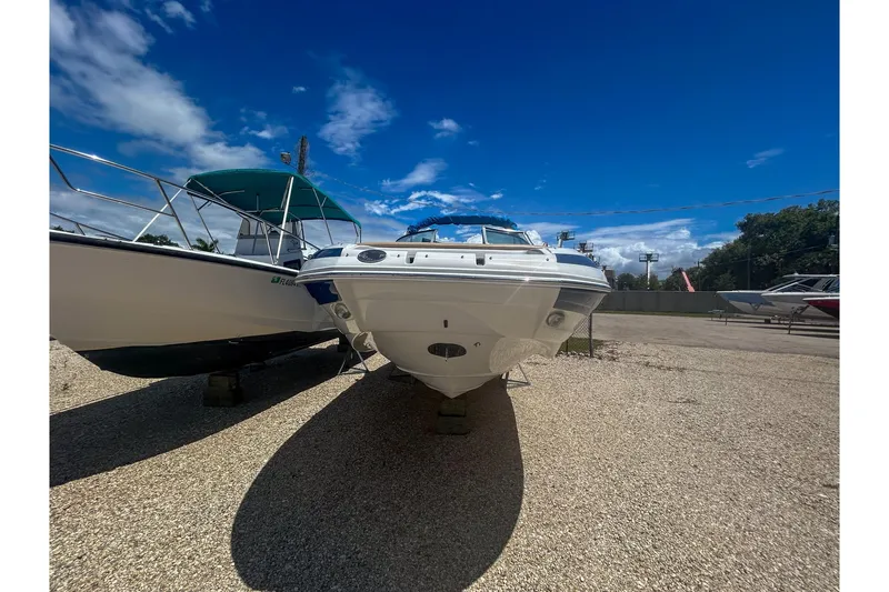 Slide: The Image of 2017 Crownline Eclipse E2 XS boat displayed outdoors under a clear blue sky. - 3