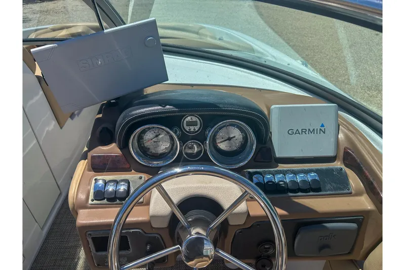 Slide: The Image of 2017 Crownline Eclipse E2 XS dashboard with Garmin and Simrad navigation systems. - 5