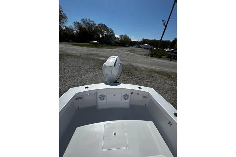Slide: The Image of Bow view of 2025 Weaver 25 boat in a sunny outdoor setting. - 12