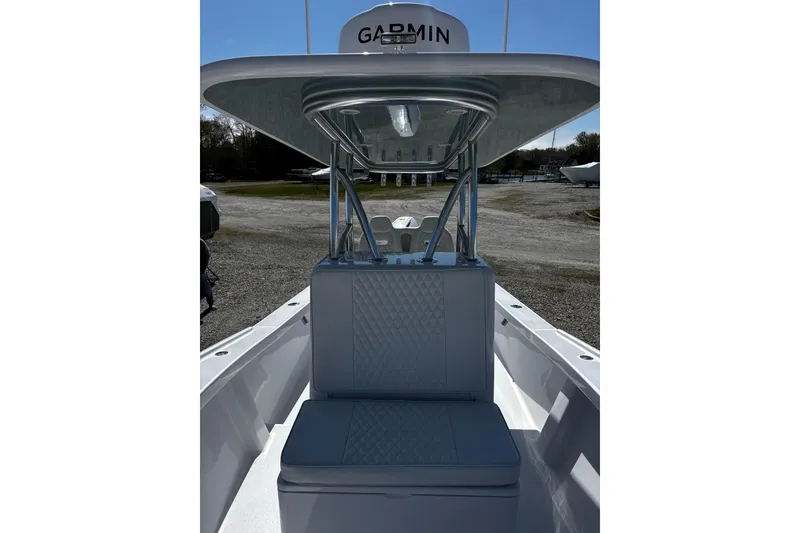 Slide: The Image of 2025 Weaver 25 boat interior with Garmin equipment and cushioned seating. - 5