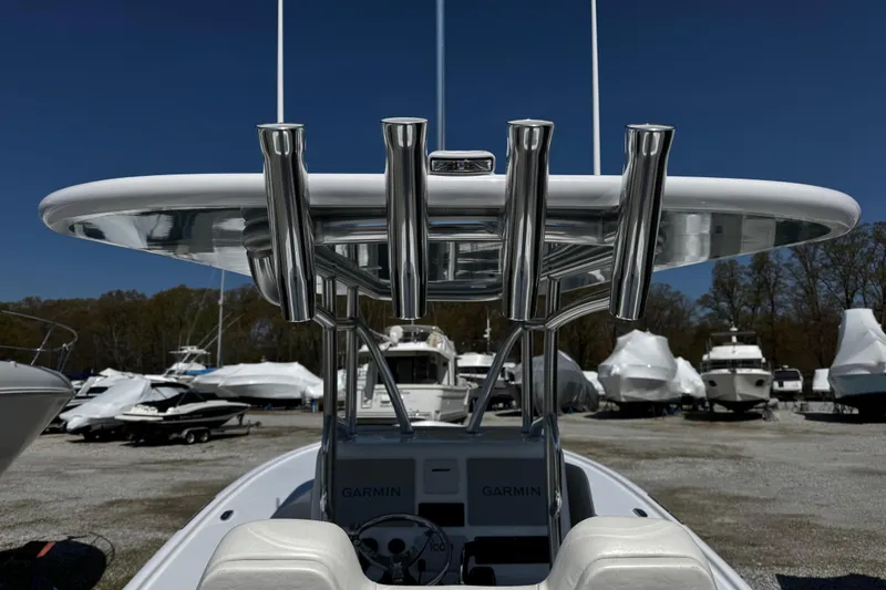 Slide: The Image of Weaver 25 boat, 2025 model, featuring stainless steel rod holders and Garmin electronics. - 6