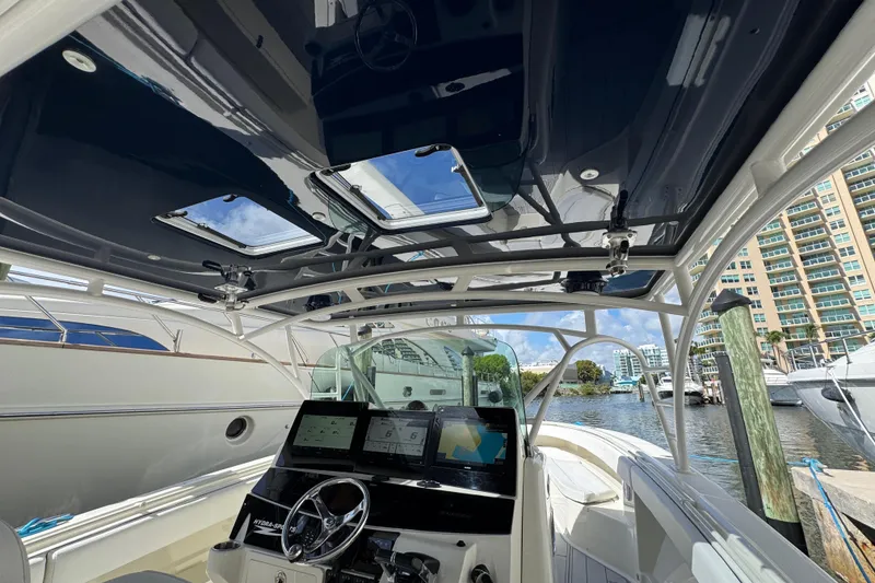 Slide: The Image of Interior view of 2012 Hydra-Sports 4200 SF boat with modern navigation equipment. - 10
