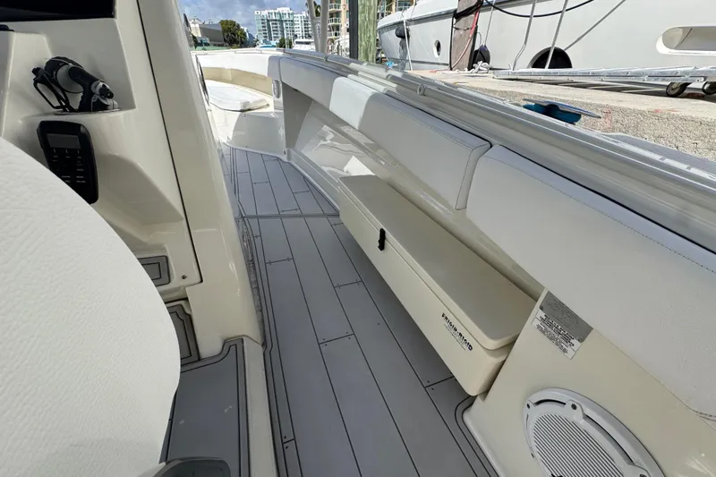 Slide: The Image of 2012 Hydra-Sports 4200 SF boat interior with seating and storage compartments. - 11