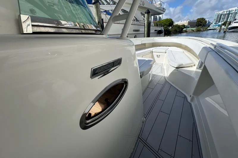 Slide: The Image of 2012 Hydra-Sports 4200 SF boat deck, showcasing sleek design and spacious seating area. - 12