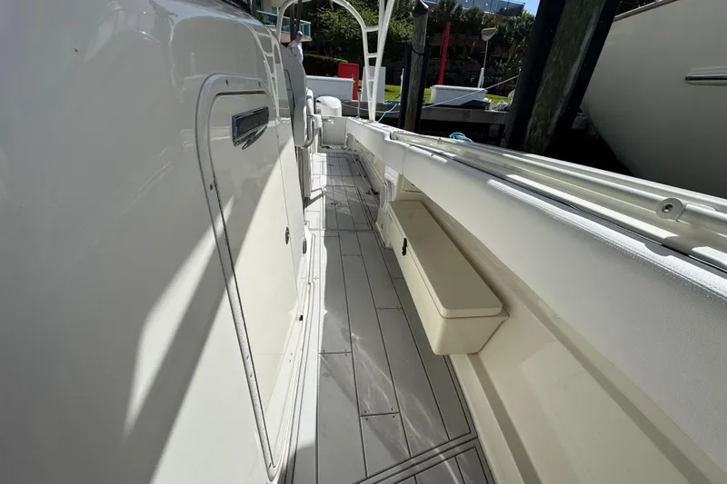 Slide: The Image of 2012 Hydra-Sports 4200 SF boat deck, showcasing sleek design and spacious walkway. - 13