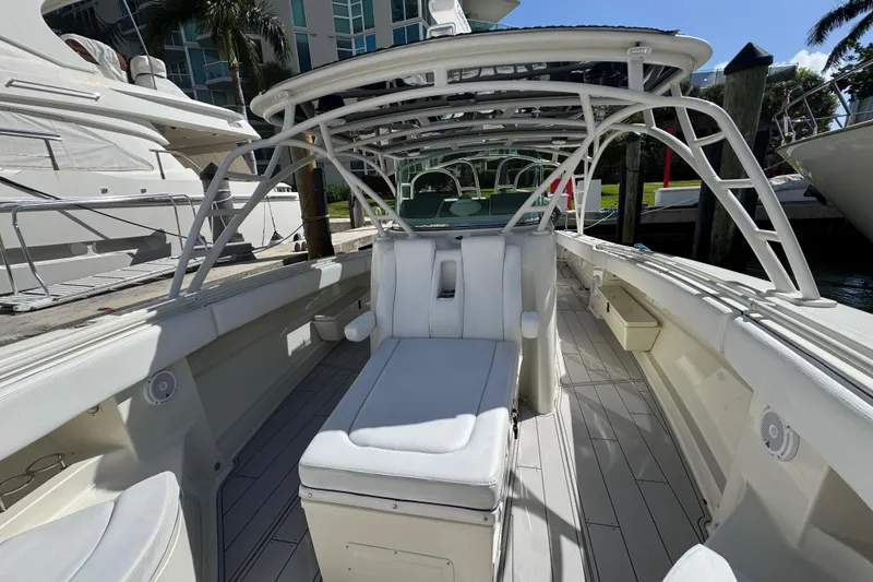 Slide: The Image of 2012 Hydra-Sports 4200 SF boat interior with seating and canopy, docked at marina. - 14
