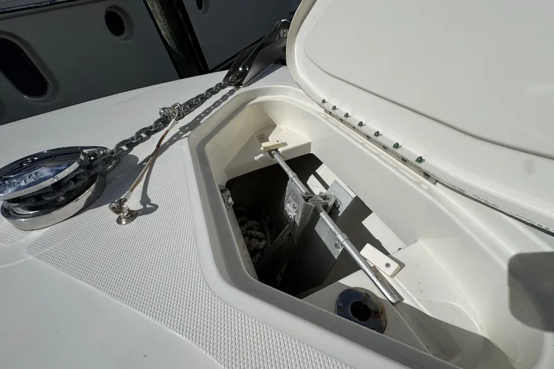 Slide: The Image of Anchor compartment of 2012 Hydra-Sports 4200 SF boat with chain and winch. - 17