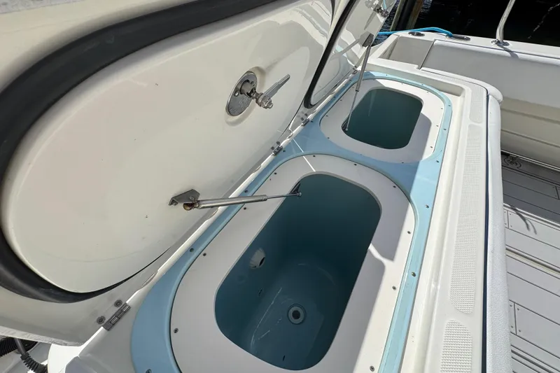 Slide: The Image of Open storage compartments on a 2012 Hydra-Sports 4200 SF boat deck. - 4