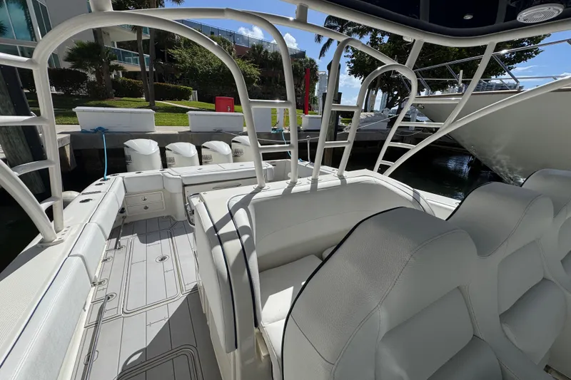 Slide: The Image of 2012 Hydra-Sports 4200 SF boat interior with white seating and spacious deck. - 6
