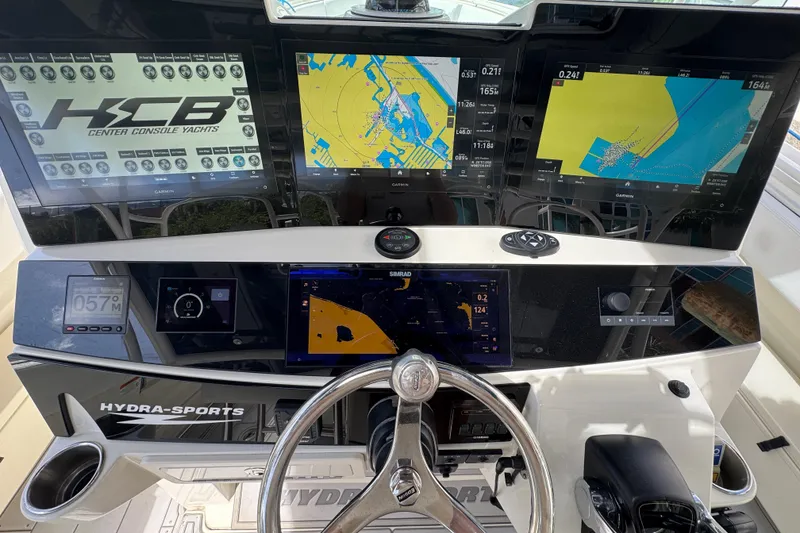 Slide: The Image of Helm of 2012 Hydra-Sports 4200 SF with advanced navigation displays and controls. - 9