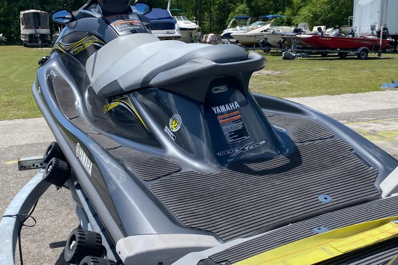 Slide: The Image of 2014 Yamaha WaveRunner VX Deluxe on trailer, surrounded by boats in a sunny outdoor setting. - 4
