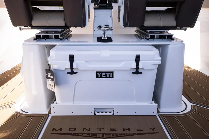 Slide: The Image of 2026 Monterey Elite 25 OB boat interior with Yeti cooler and seating. - 22