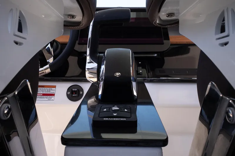 Slide: The Image of Control panel of 2026 Monterey Elite 25 OB boat, featuring sleek design and advanced technology. - 23