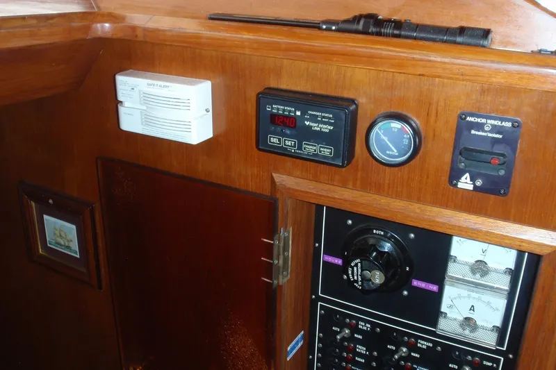 Slide: The Image of Control panel of a 1985 Ocean Alexander boat with various gauges and switches. - 46