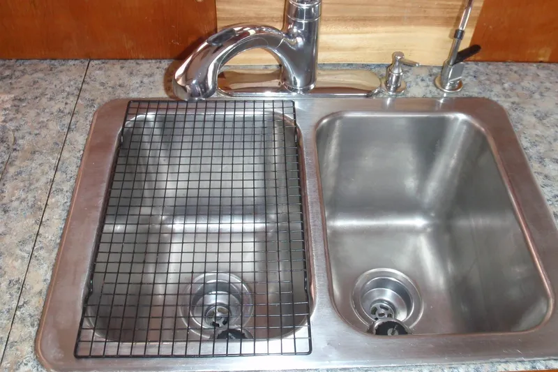 Slide: The Image of Stainless steel double sink with faucet on Ocean Alexander 1985 model. - 51