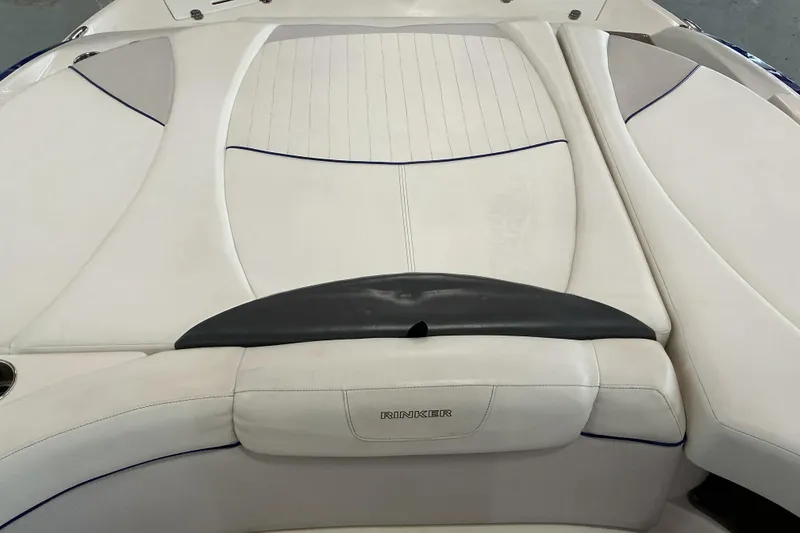Slide: The Image of 2008 Rinker 226 Captiva Bowrider boat interior with white cushioned seating. - 16