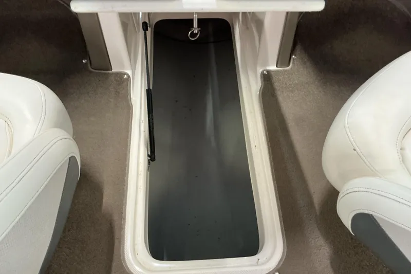 Slide: The Image of Storage compartment in 2008 Rinker 226 Captiva Bowrider boat interior. - 25