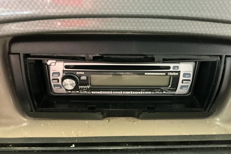 Slide: The Image of Clarion stereo system in a 2008 Rinker 226 Captiva Bowrider boat dashboard. - 27